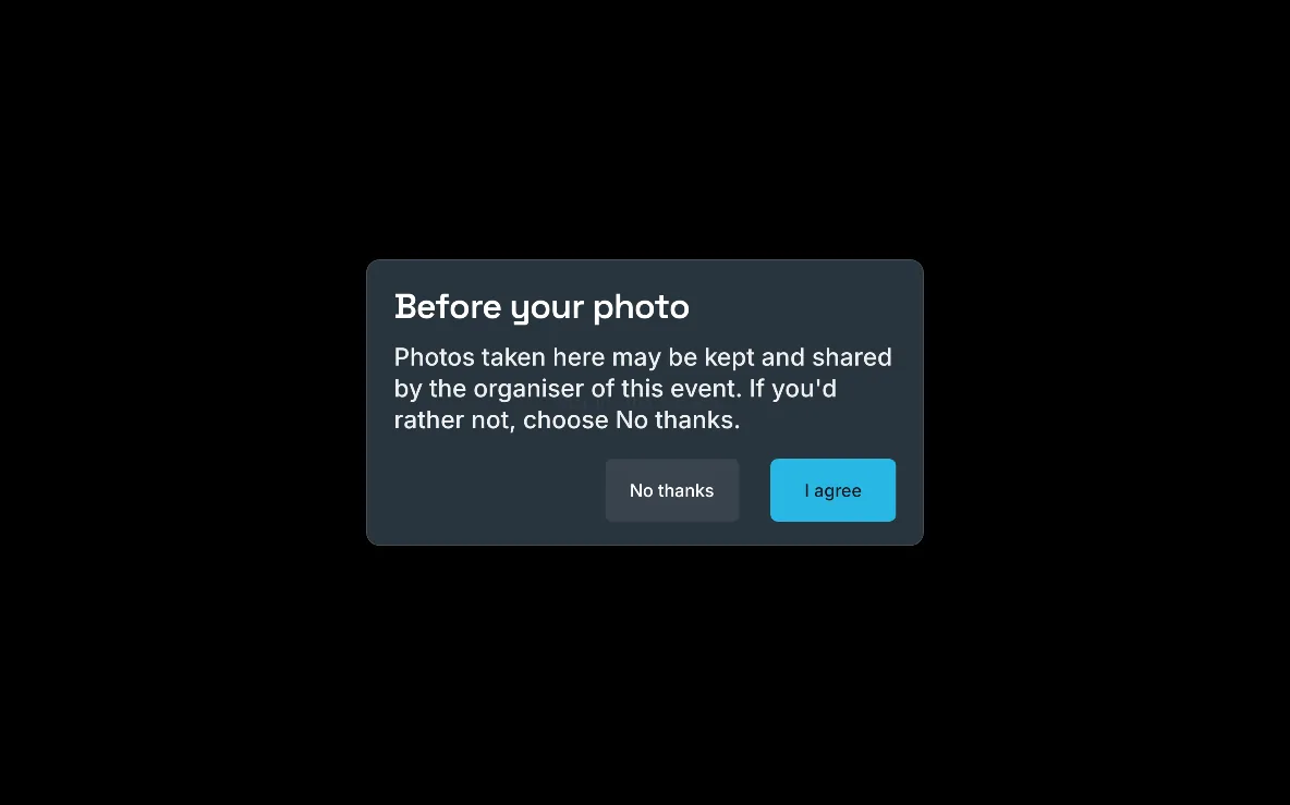 A consent card on the booth, “Before your photo”, with No thanks and I agree, on a large screen in landscape.